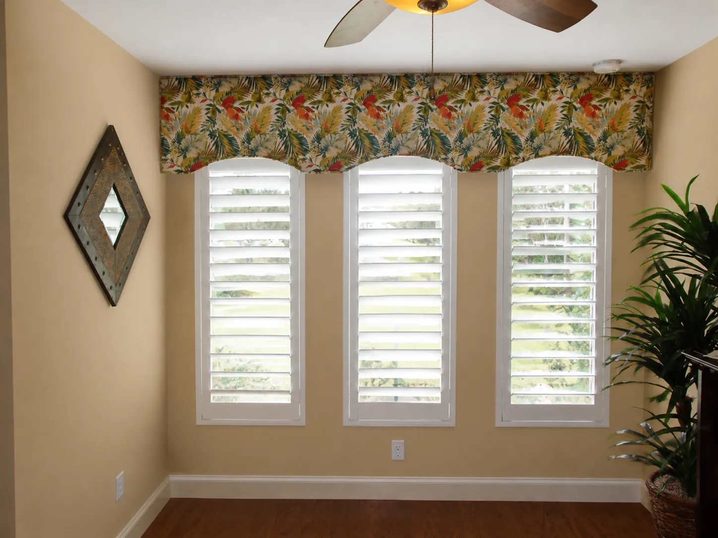 Three custom white plantation shutters fitted to narrow windows in a Nocatee home
