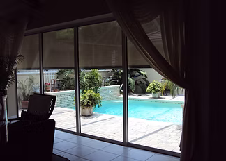 Motorized roll screen for a Nocatee lanai