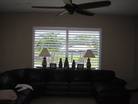 Wide living room plantation shutter installation for a Nocatee homeowner